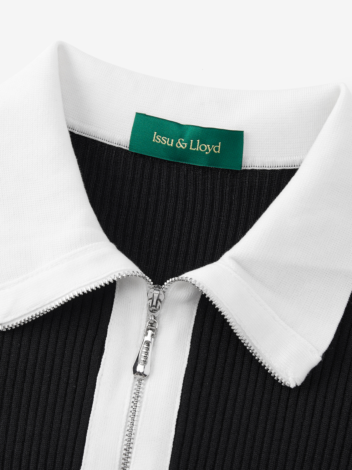 Ophelia geribde polo met kwartrits van lyocell voor dames in zwart – Issu & Lloyd